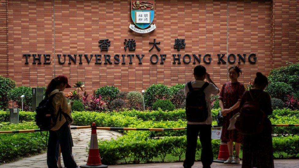 People are taking pictures with the HKU sign at the University of Hong Kong in Hong Kong, on April 30, 2024