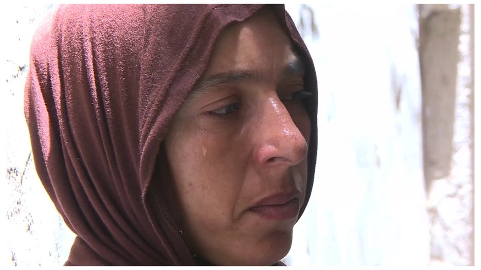 A woman in tears in a village in Egypt