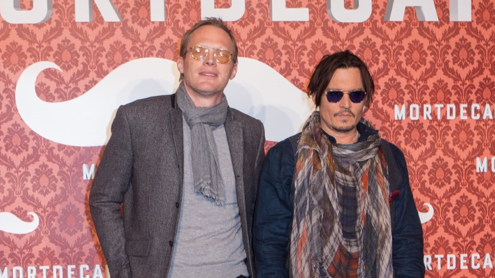 Paul Bettany and Johnny Depp attend a photo call for the film 'Mortdecai