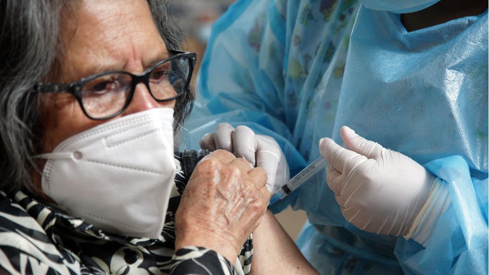 A woman is vaccinated in Cuenca, Ecuador