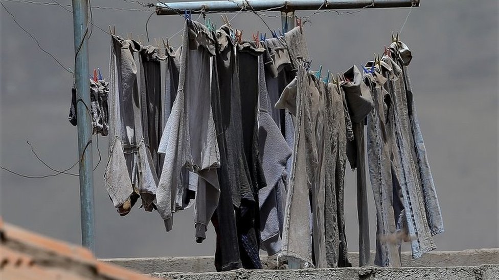 View of ash from the Sangay volcano on jeans hanging on a clothesline in the town of Alausi, in the province of Chimborazo, Ecuador, 20 September 2020.