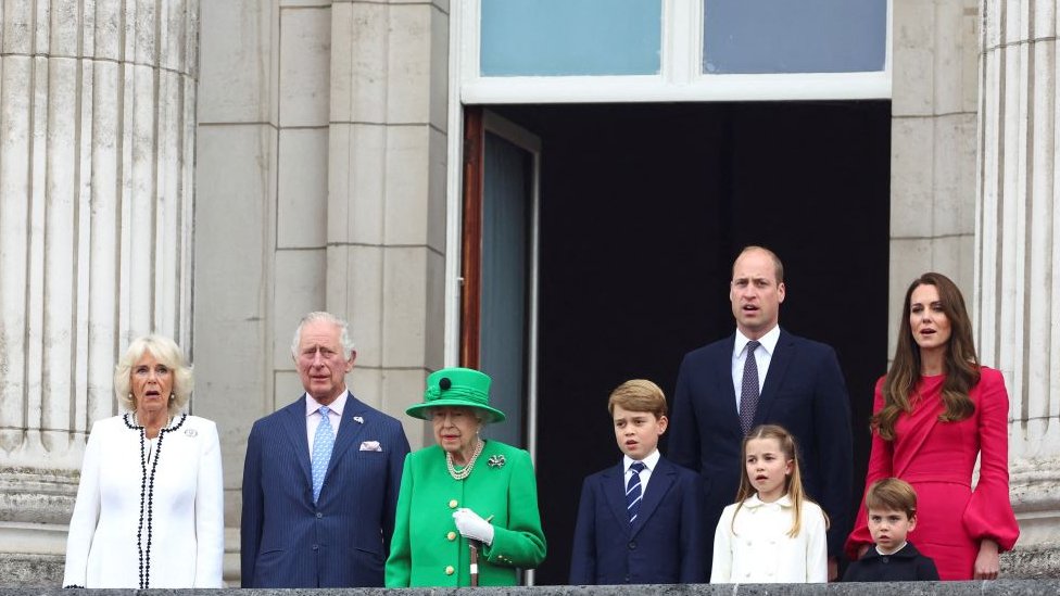Queen Elizabeth II stands on Buckingham Palace balcony with, from left: Camilla, Duchess of Cornwall, Prince Charles, Prince of Wales, Prince George of Cambridge, Prince William, Duke of Cambridge, Princess Charlotte of Cambridge, Catherine, Duchess of Cambridge, and Prince Louis of Cambridge