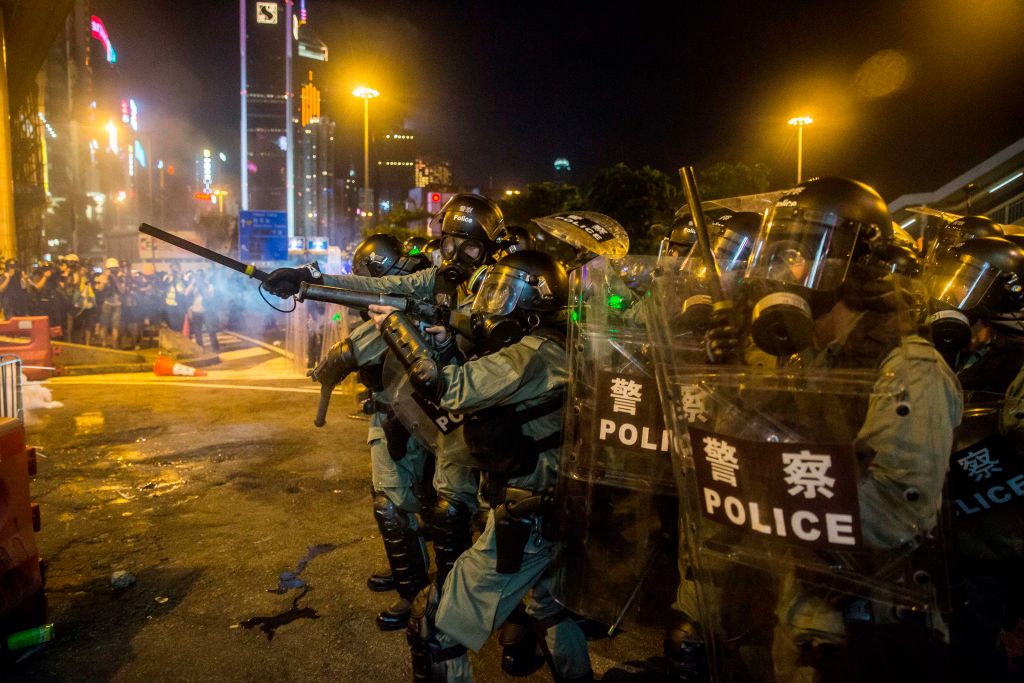 Police fire tear gas during a protest in the district of Causeway Bay in Hong Kong