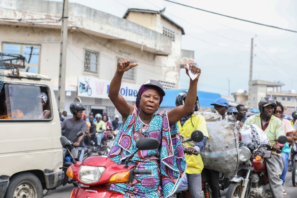 A woman riding on a motorcycle 