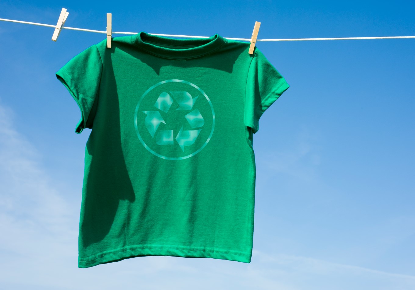 Green t-shirt with a recycle logo, Getty