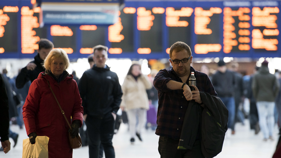 Passengers at a mainline railway station