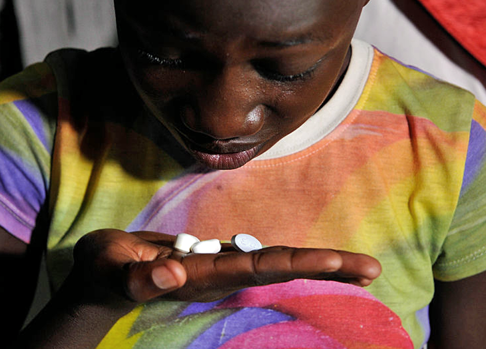 A child in Kenya taking ARV medication