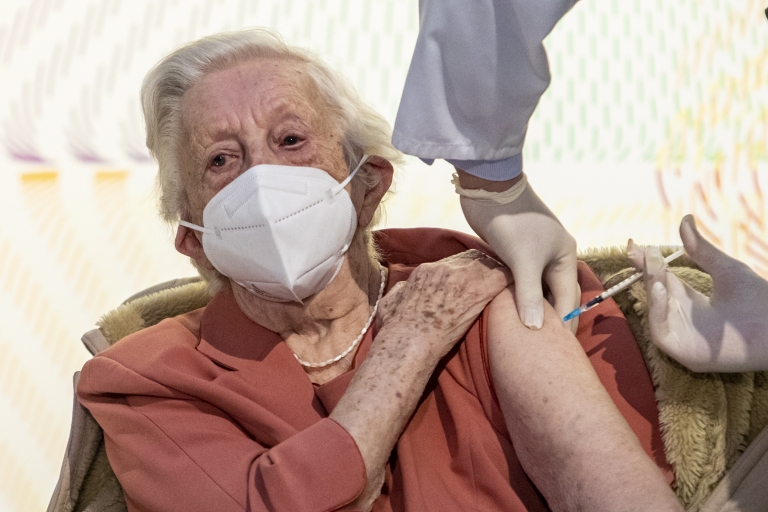 Emilie Repikova receives a vaccine