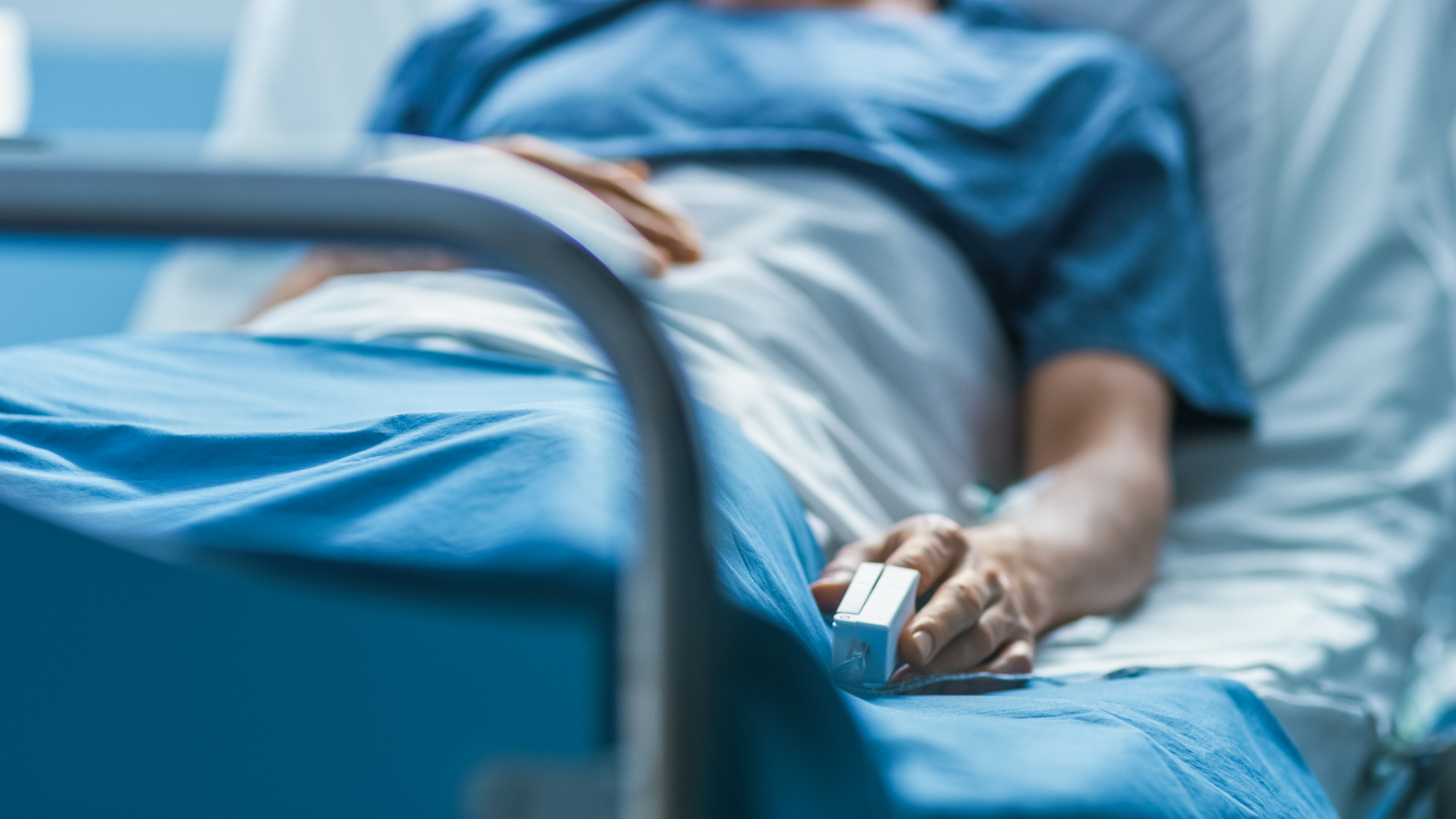 Stock image of patient in hospital bed