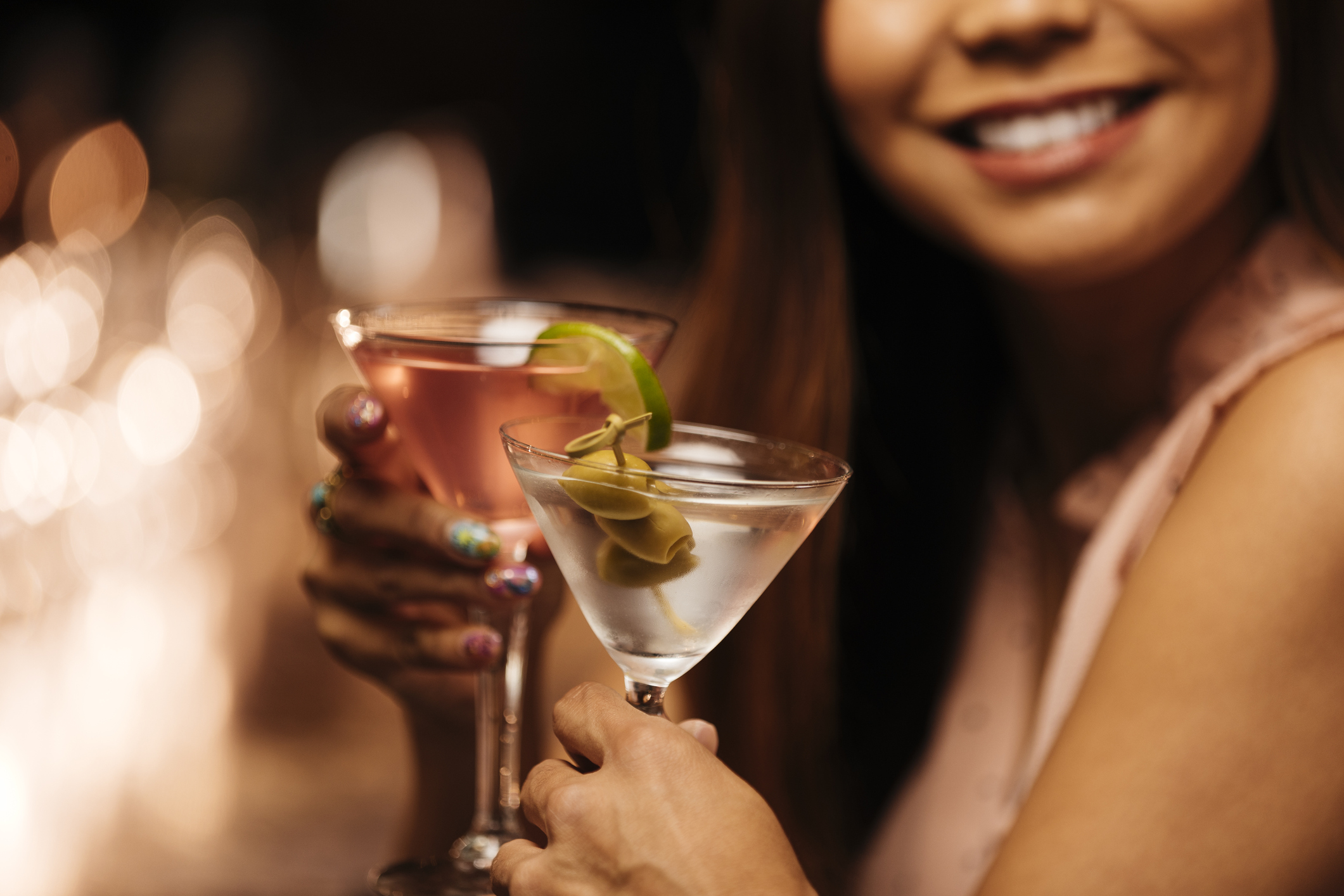 Woman holding an alcoholic cocktail
