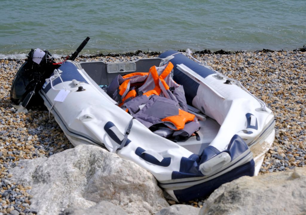 A boat used by migrants on the shore at Kingsdown Beach August 31, 2019 in Dover, England