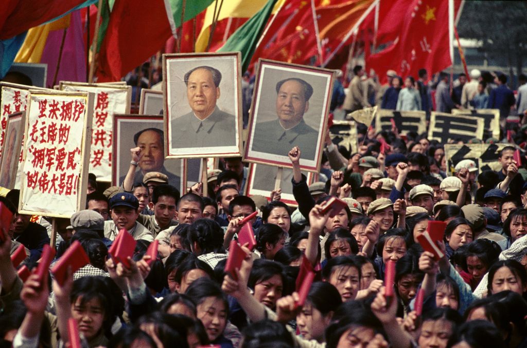 People holding pictures of Mao and the Little Red Book in Tiananmen Square, 1966