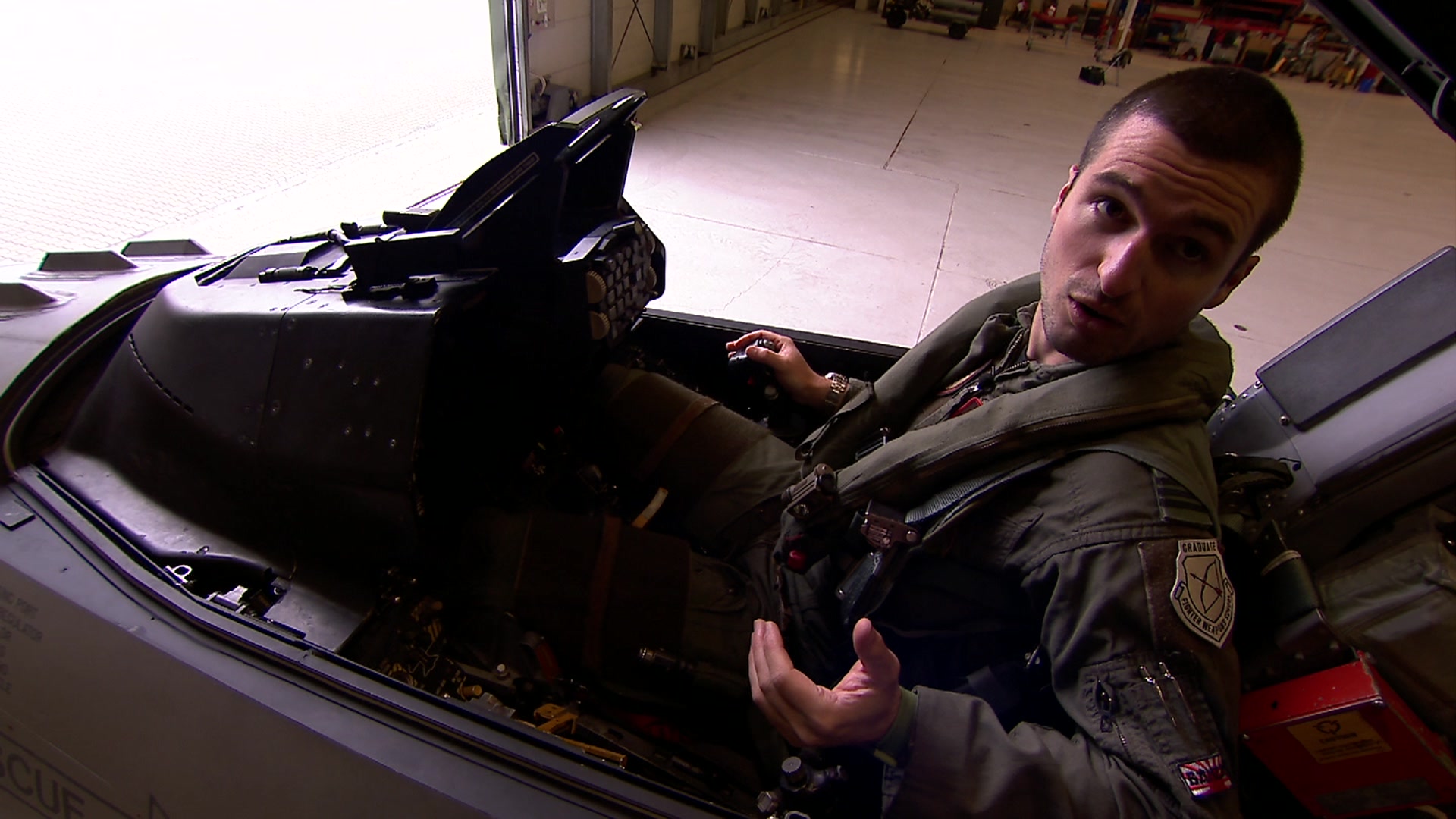 Belgian fighter pilot Pulse sits inside the cockpit of his F16 fighter jet