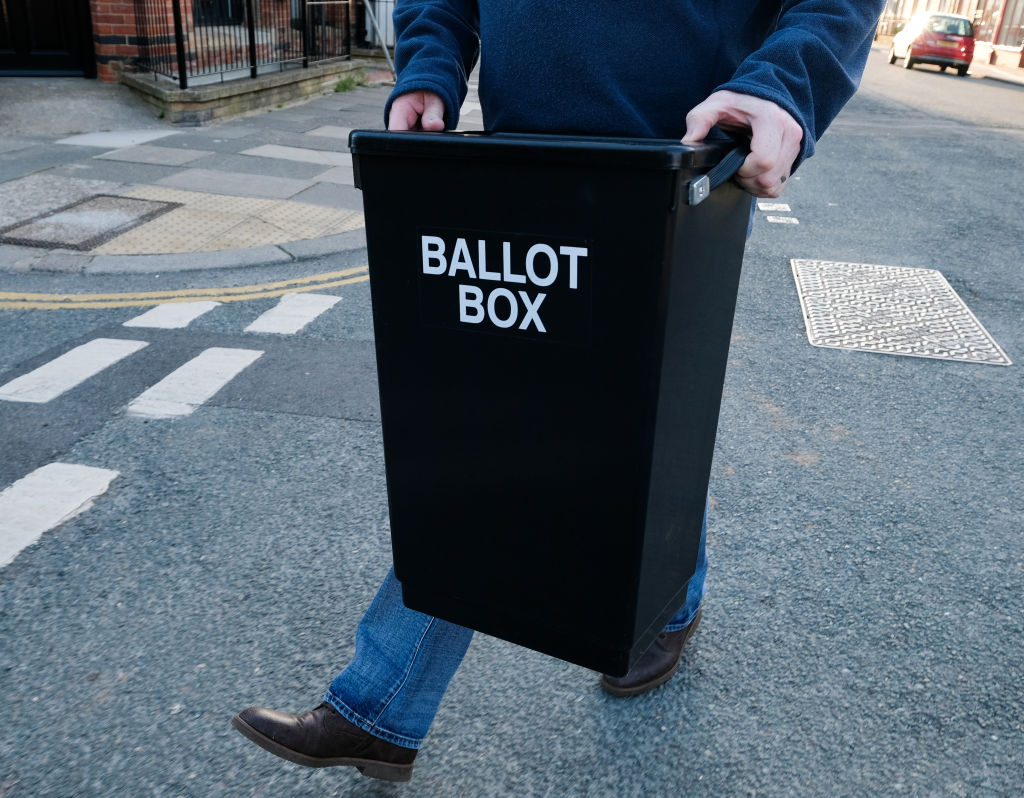 Man holding a ballot box