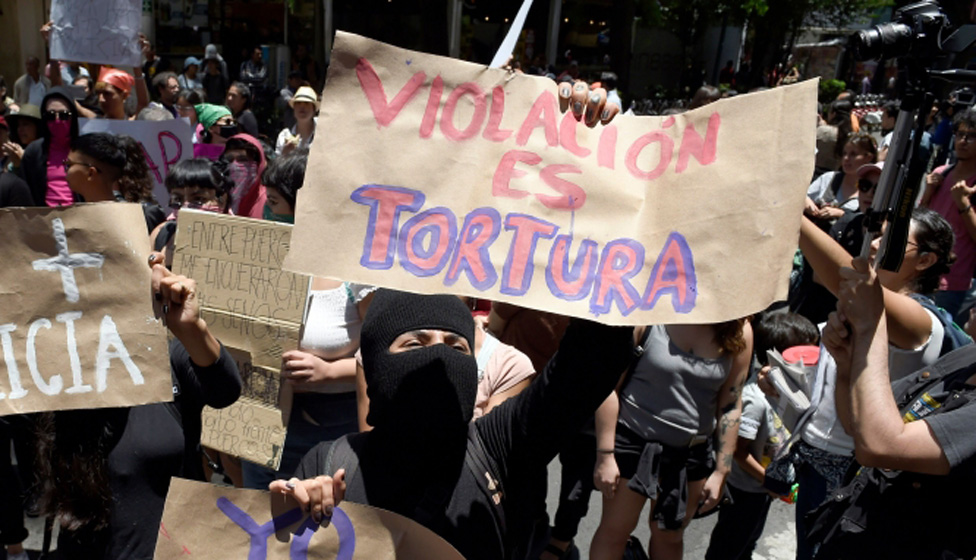 A woman protests after an alleged rape in Mexico City.