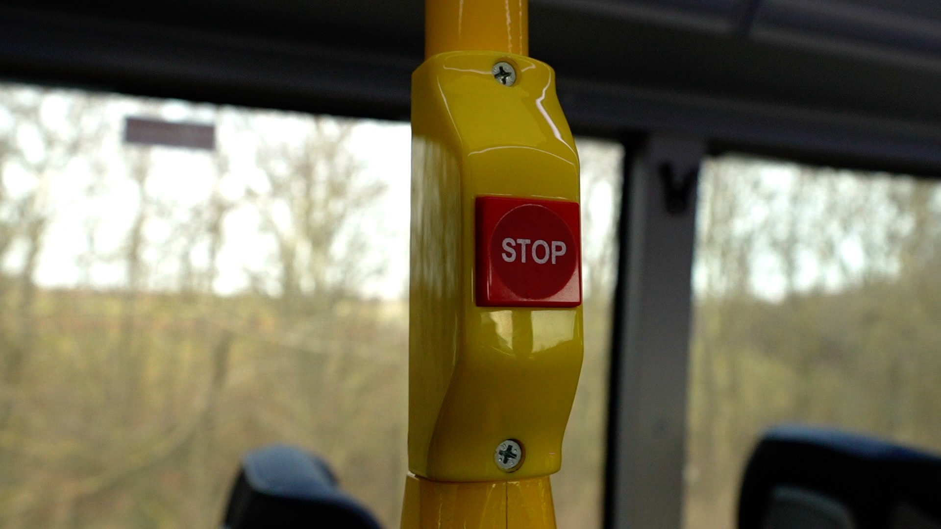 A stop button on a bus