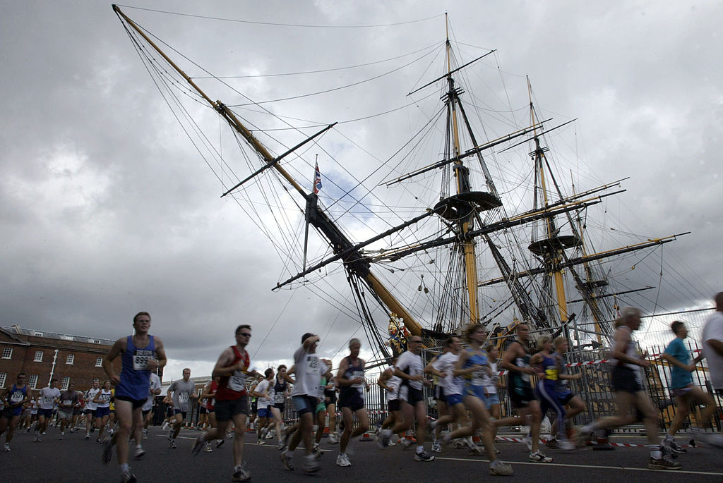 Runners in the Great South Run (2002) passing  HMS Victory