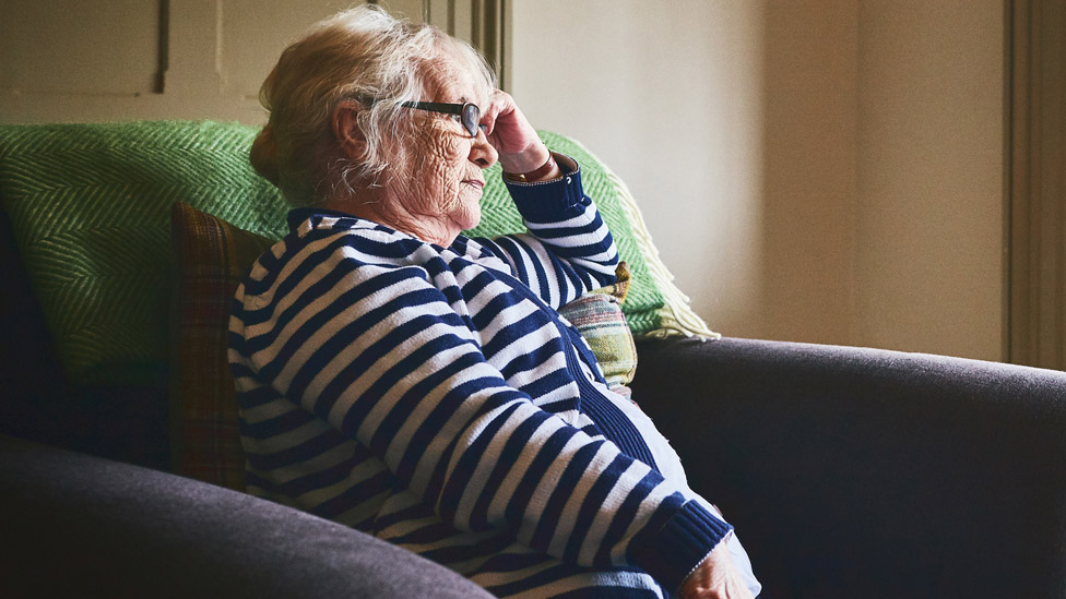 Pensioner watching TV