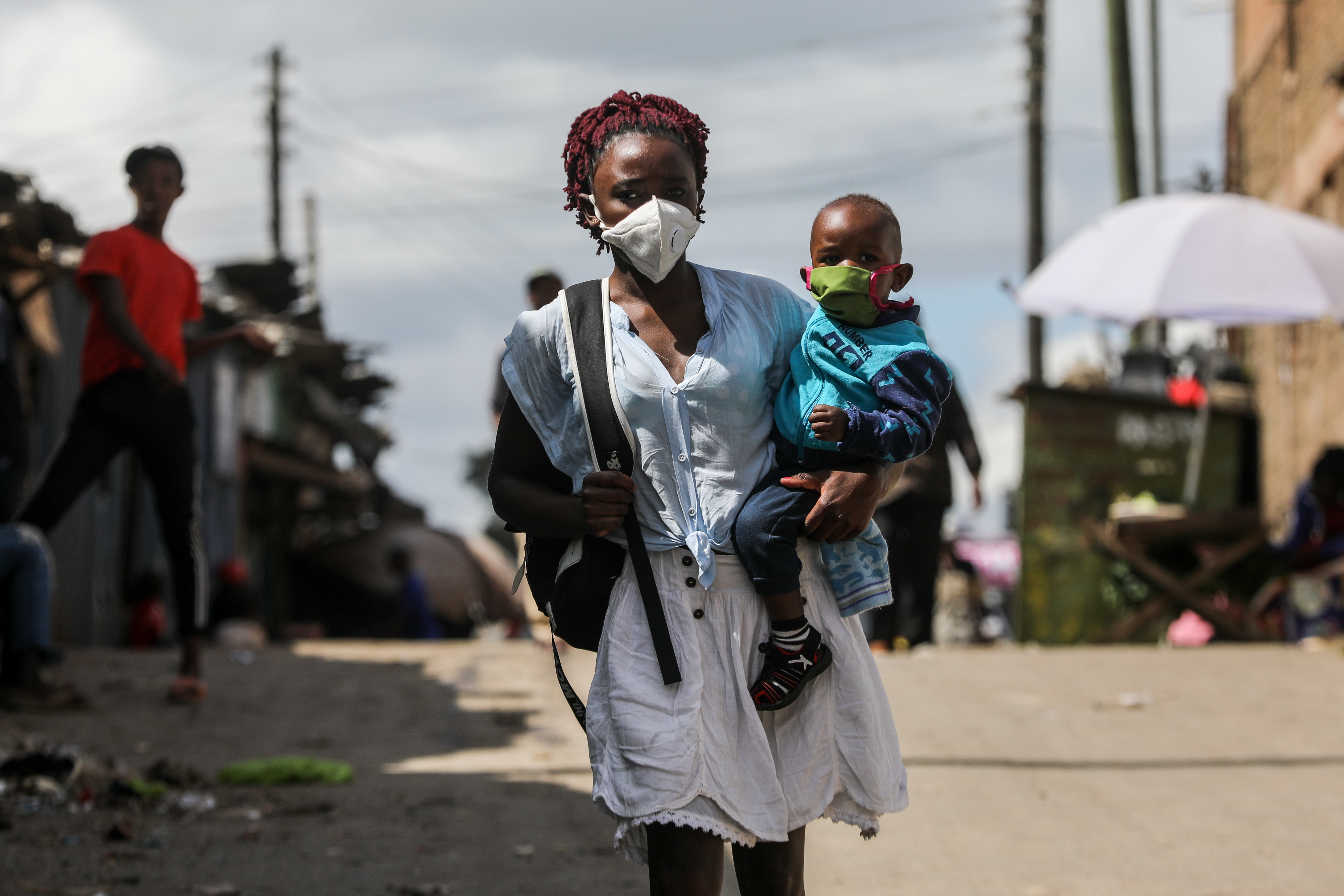 Woman walking with her child