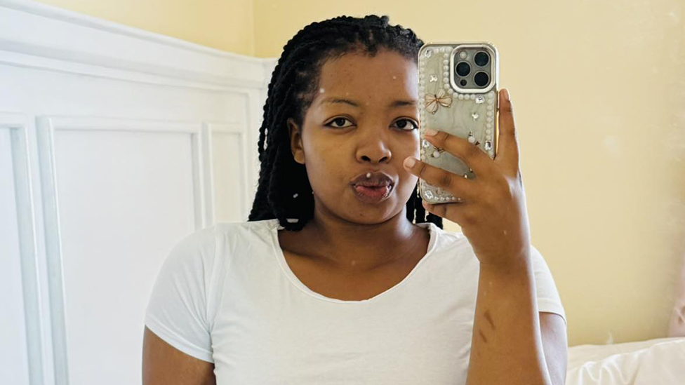 Naomi Kuria taking a mirror selfie