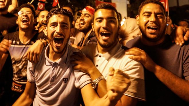 People in Tunis celebrating the victory of Kais Saied in Tunisia's presidential run-off 