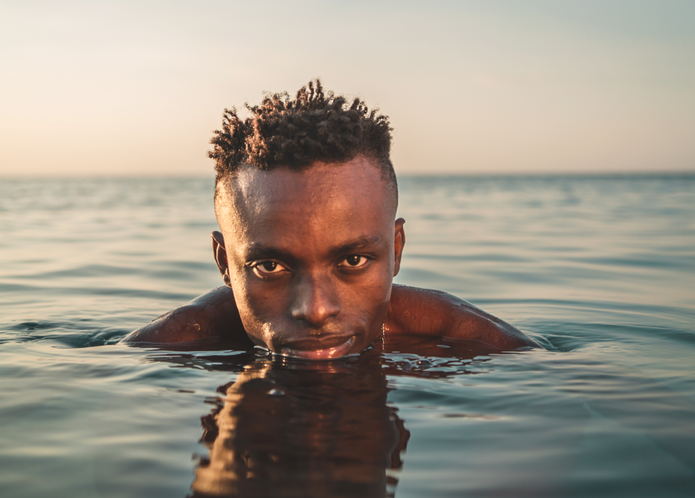 Photo of Chris Obehi in the sea