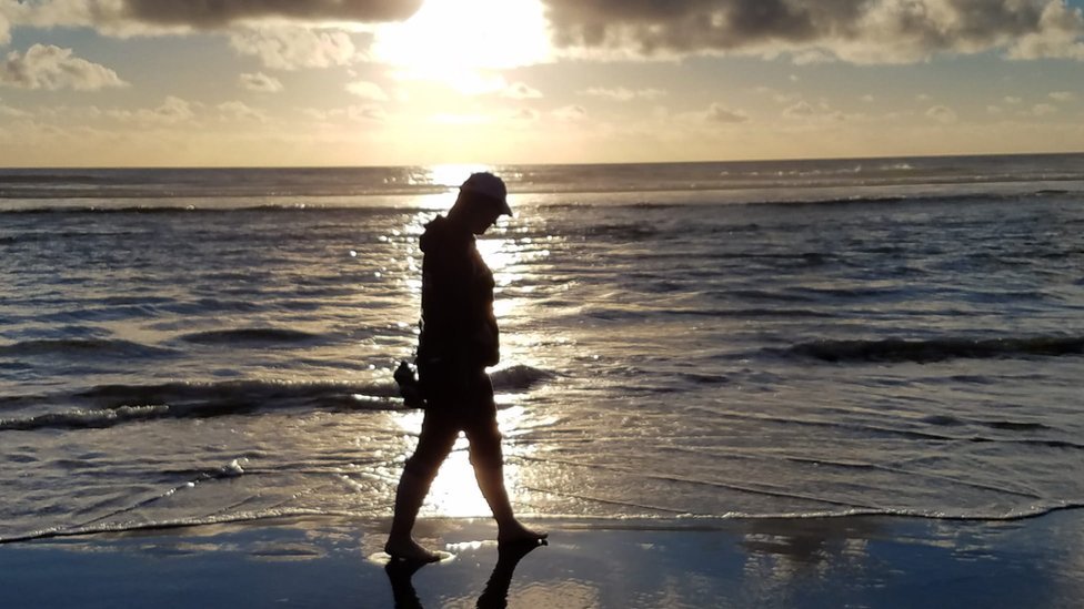Woman walking on beach
