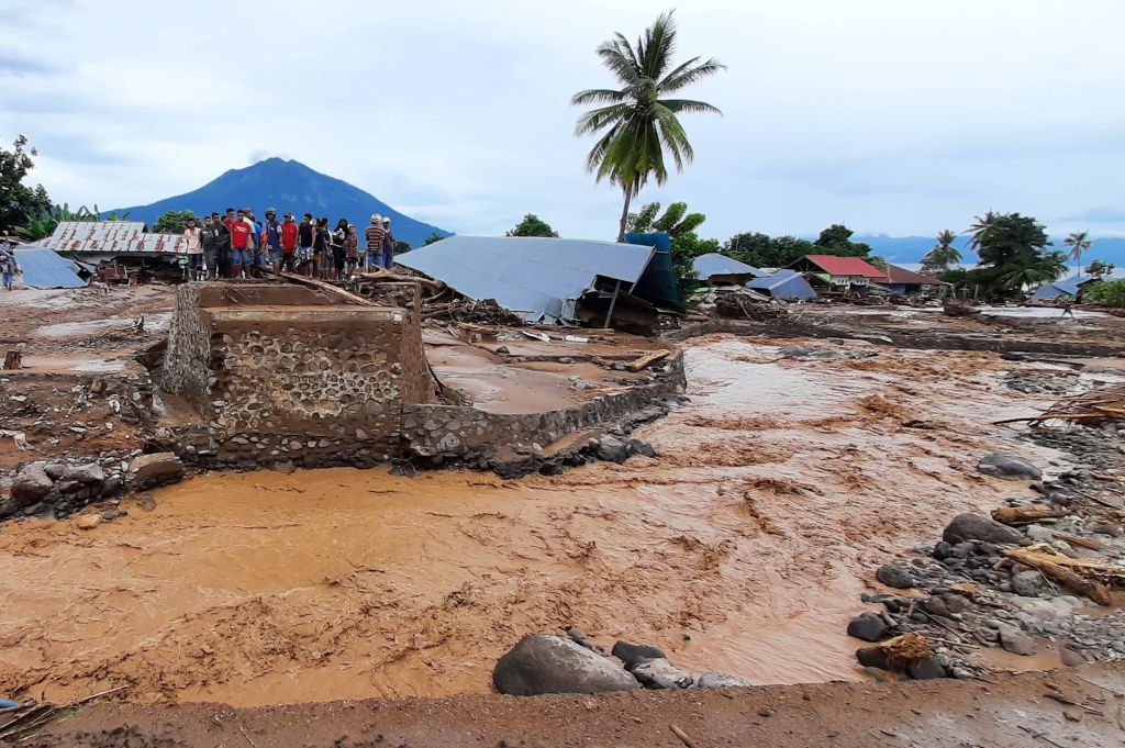 his picture taken on April 5, 2021 shows damaged homes after a flash flood in Waiwerang village, East Flores, as at least 157 people have been killed in Indonesia and neighbouring 
