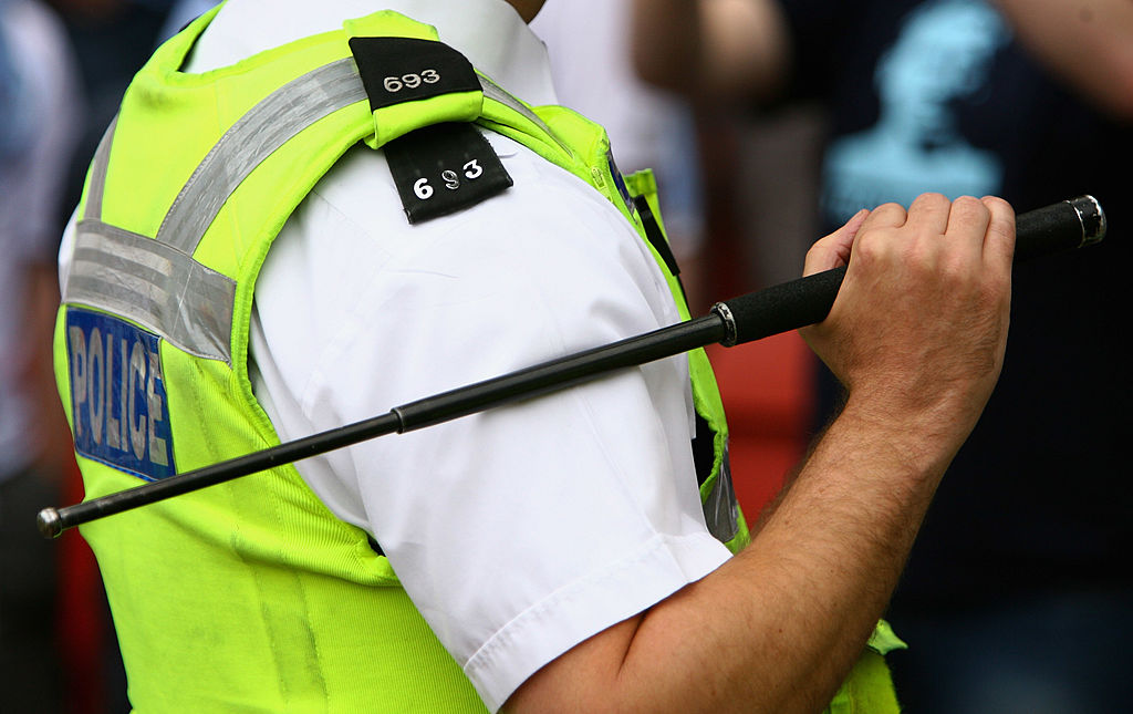 Cleveland police officer with asp baton