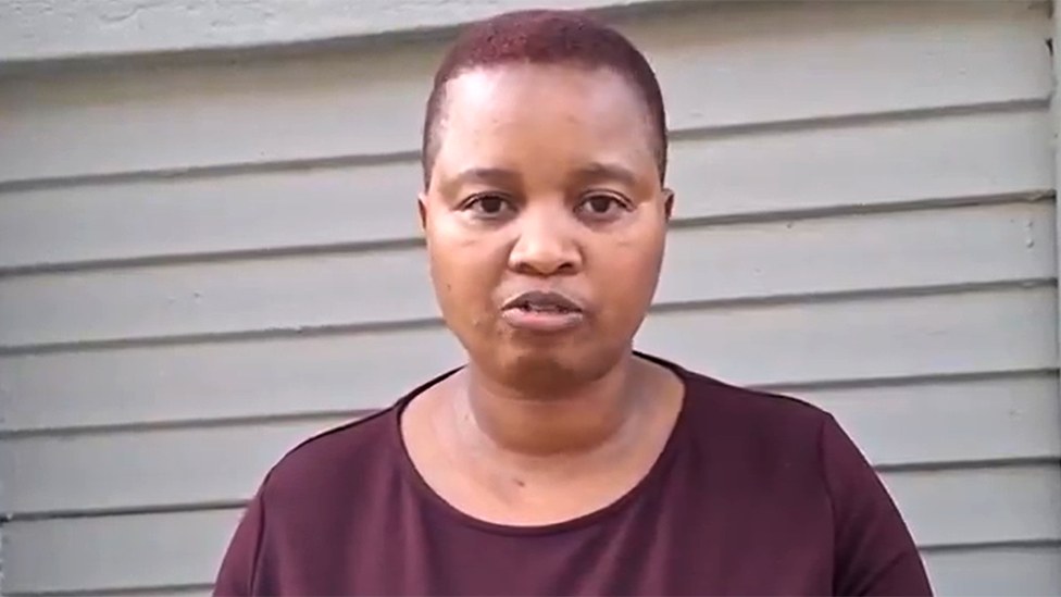 Thabile Mdluli  looking at the camera. She is wearing a burgundy-coloured top.