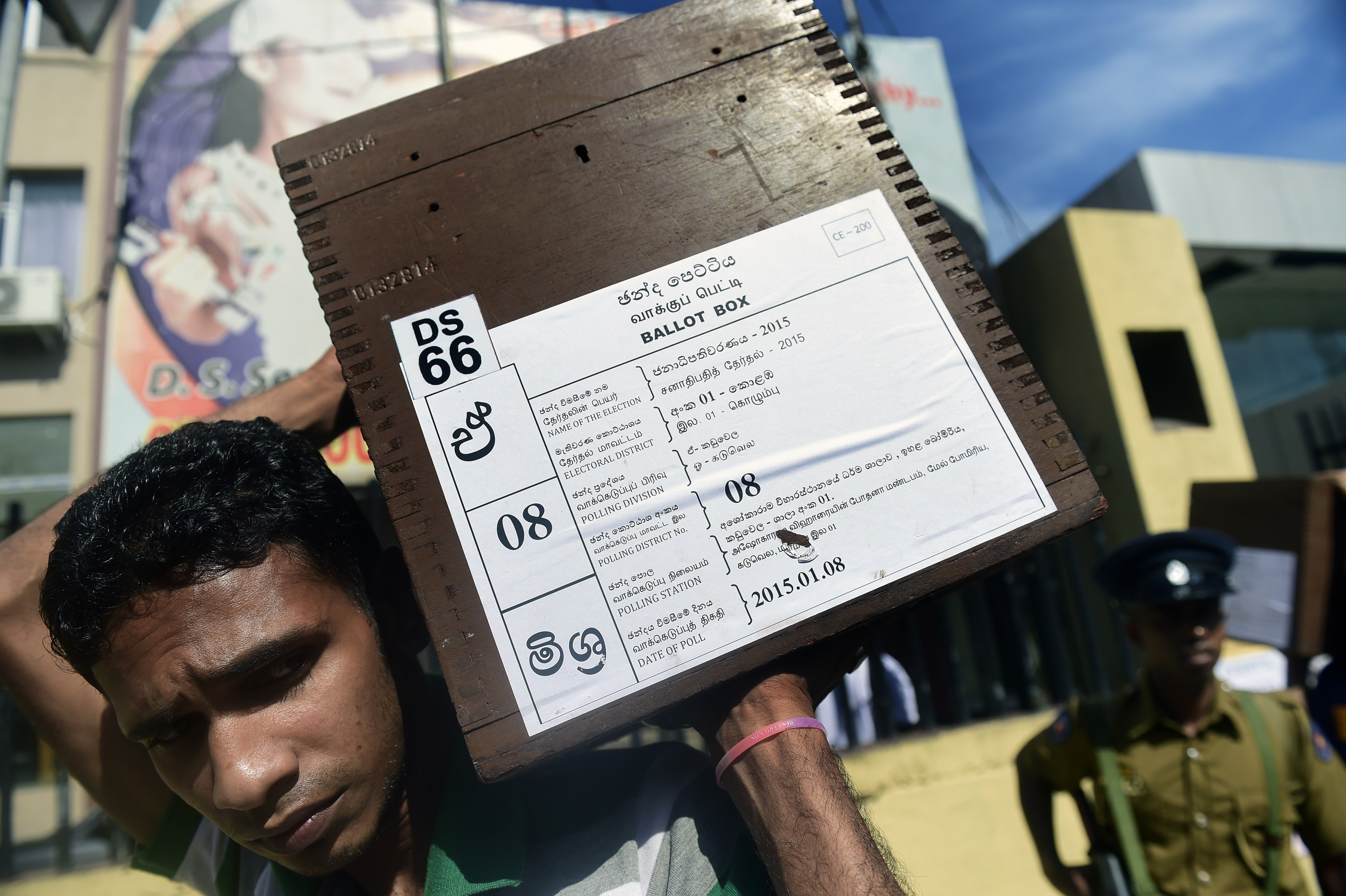 A person transporting ballot boxes