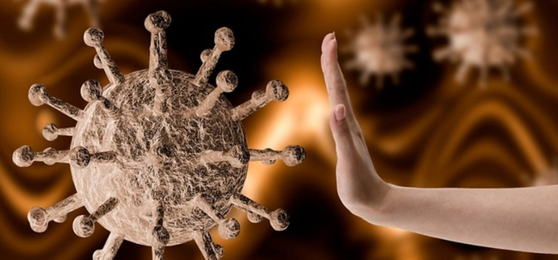 Representation of the virus and a hand