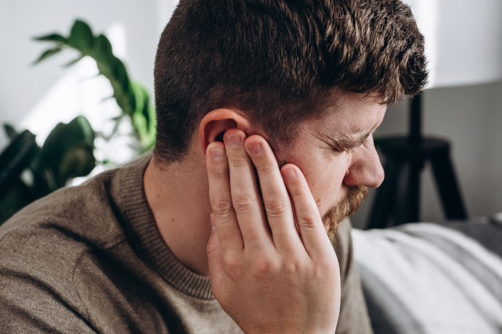 Man in ear pain