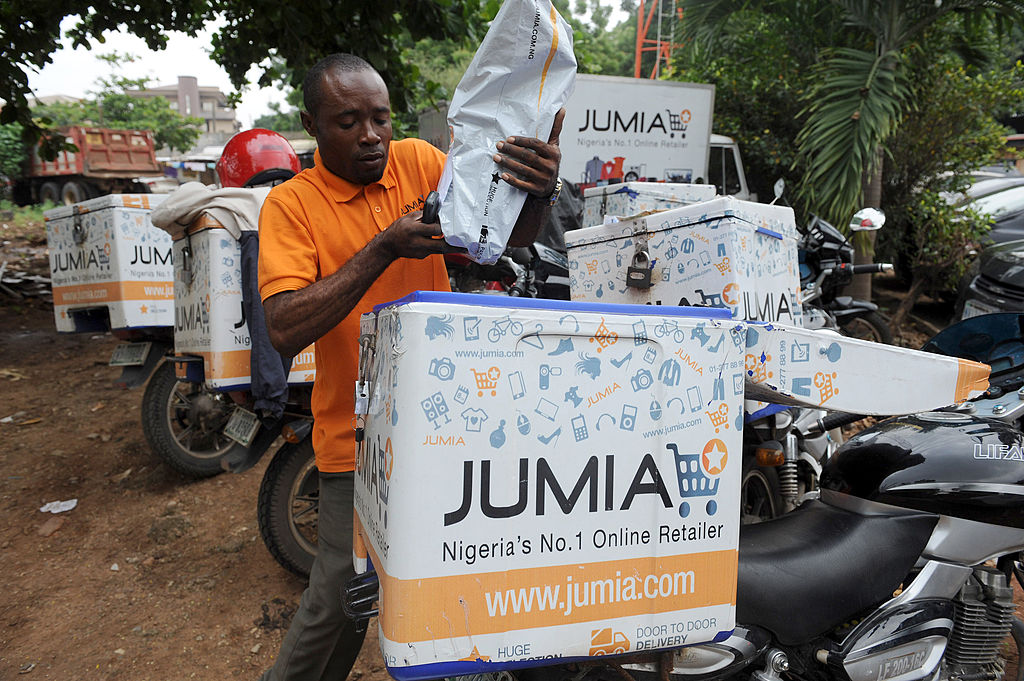 A Jumia scooterman arranges product to be delivered to clients at the Ikeja warehouse of the company in lagos on June 12, 2013
