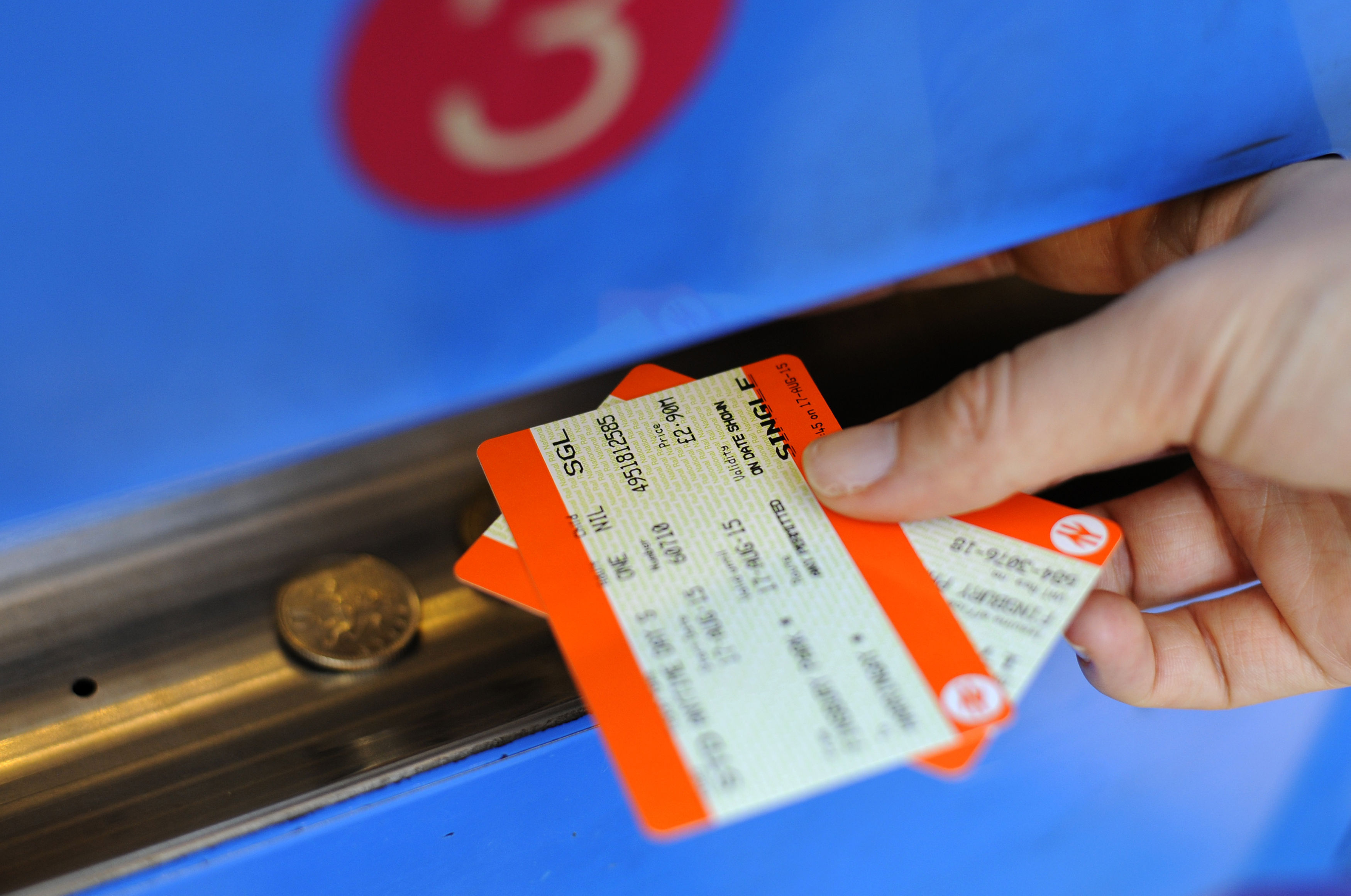 A person buying a train ticket