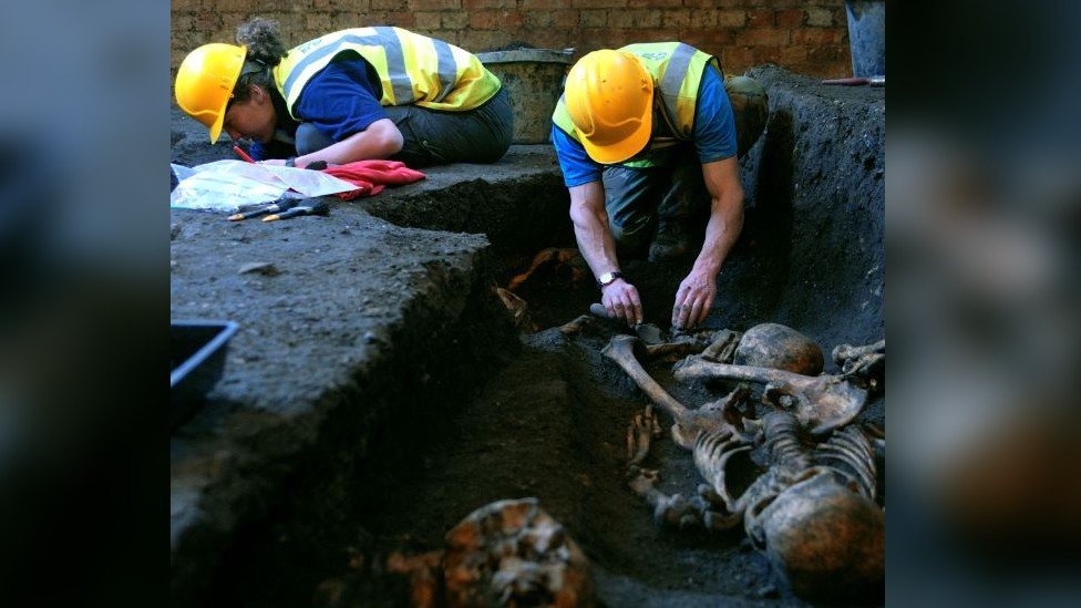 Archaeologists excavating a medieval graveyard in Cambridge