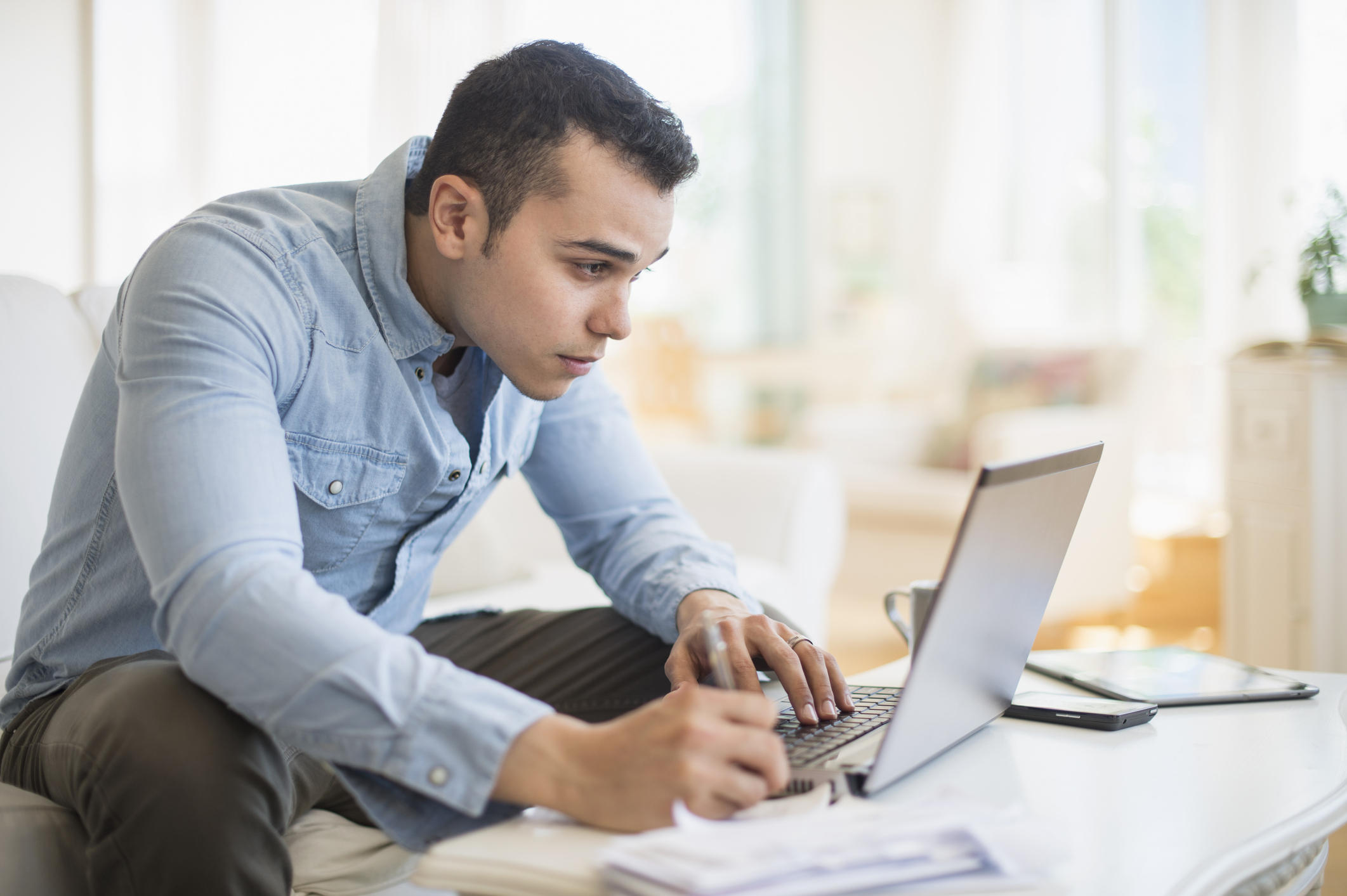 A young man on his computer