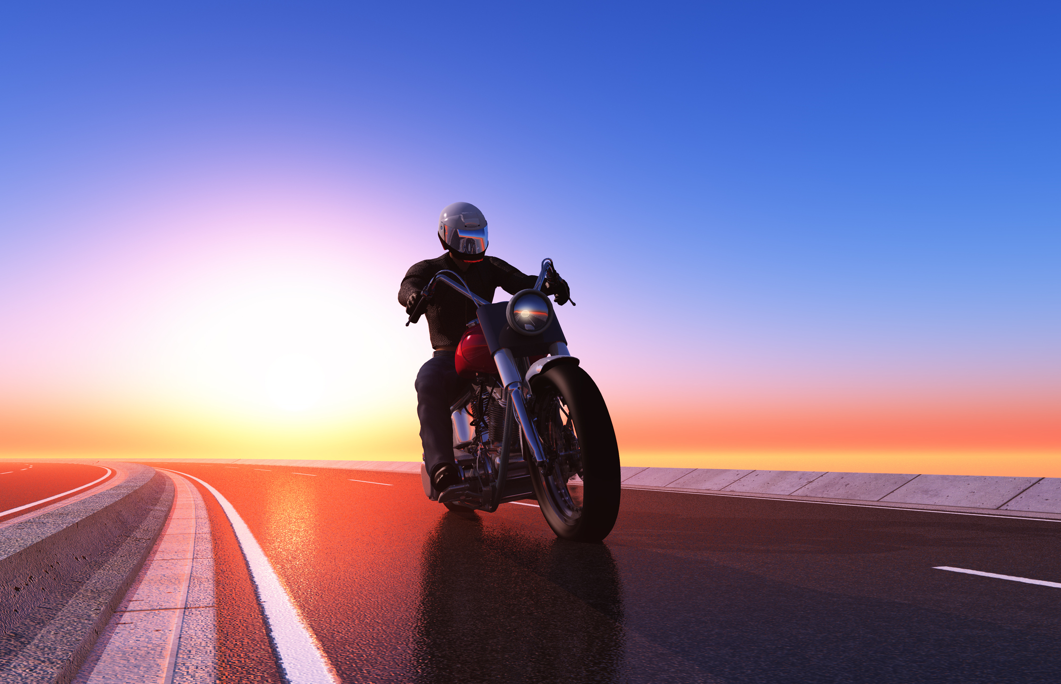 A motorcyclist riding at sunset