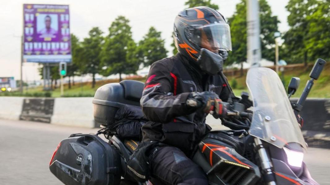 Udoh Ebaide Joy on a bike