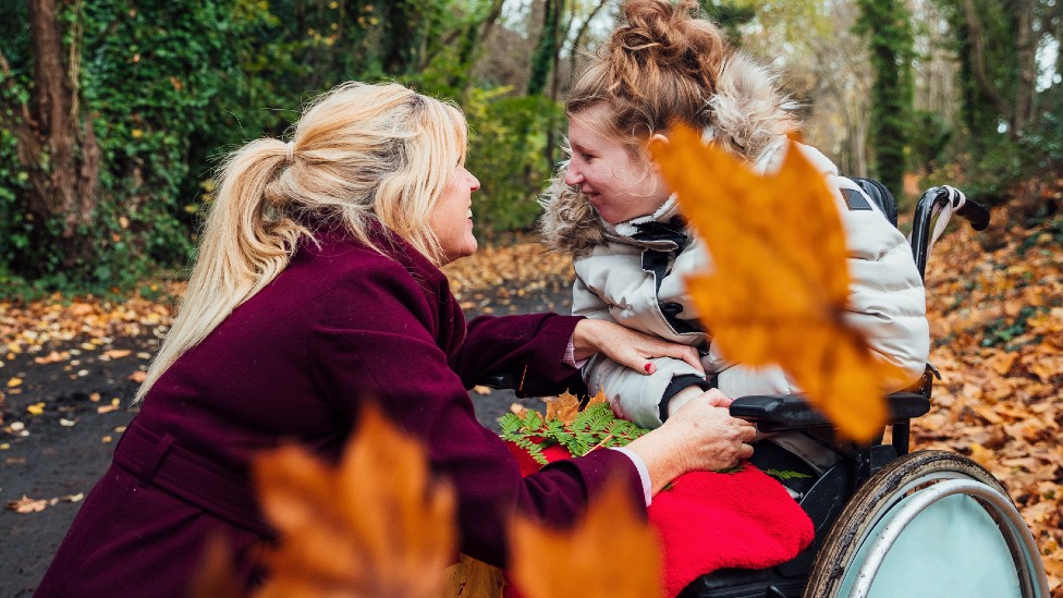 Young woman and older wooman in autumnal setting