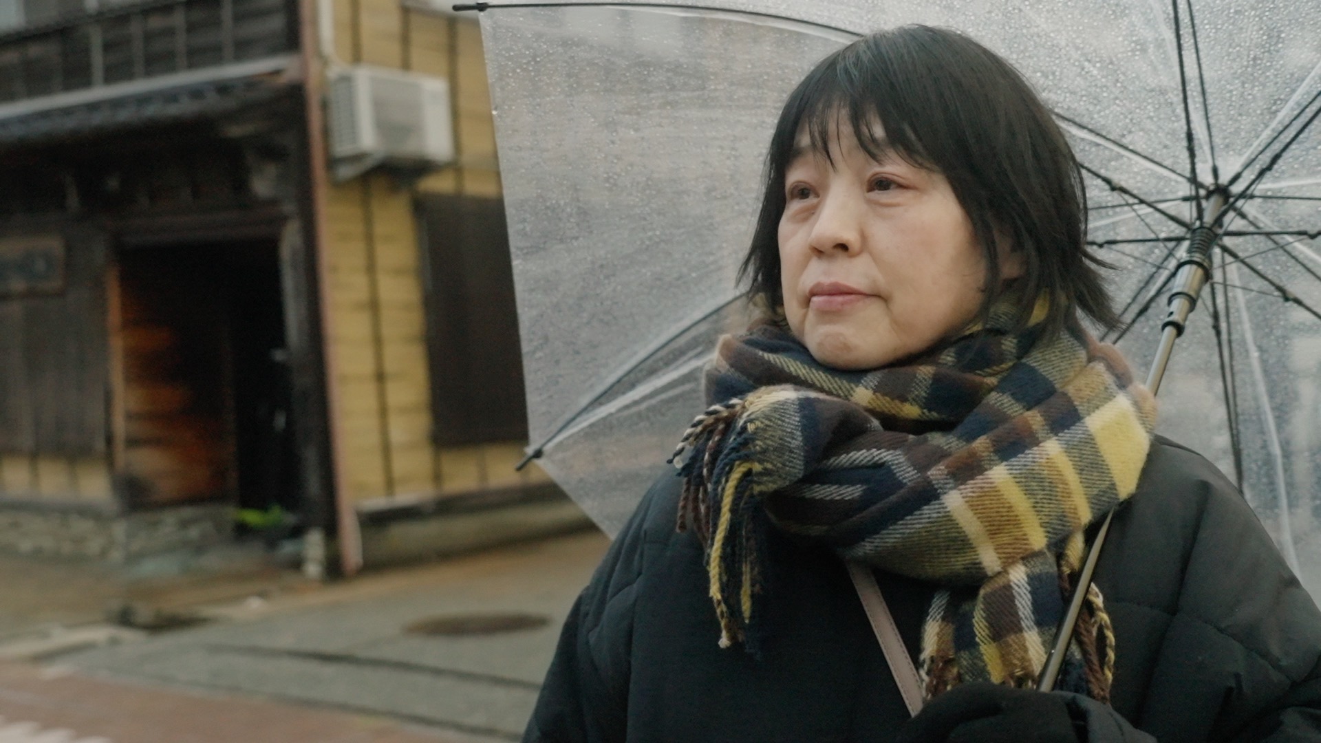 Keiko Kato stands in front of camera