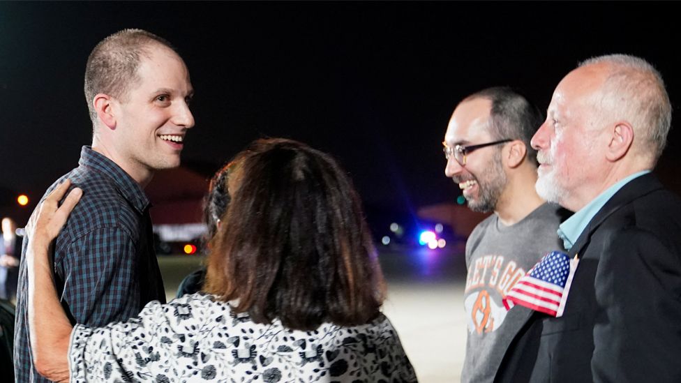 Americans freed in Russia prisoner swap land in US