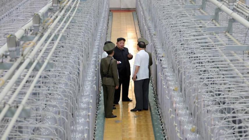 North Korea releases rare photos of Kim in nuclear facility