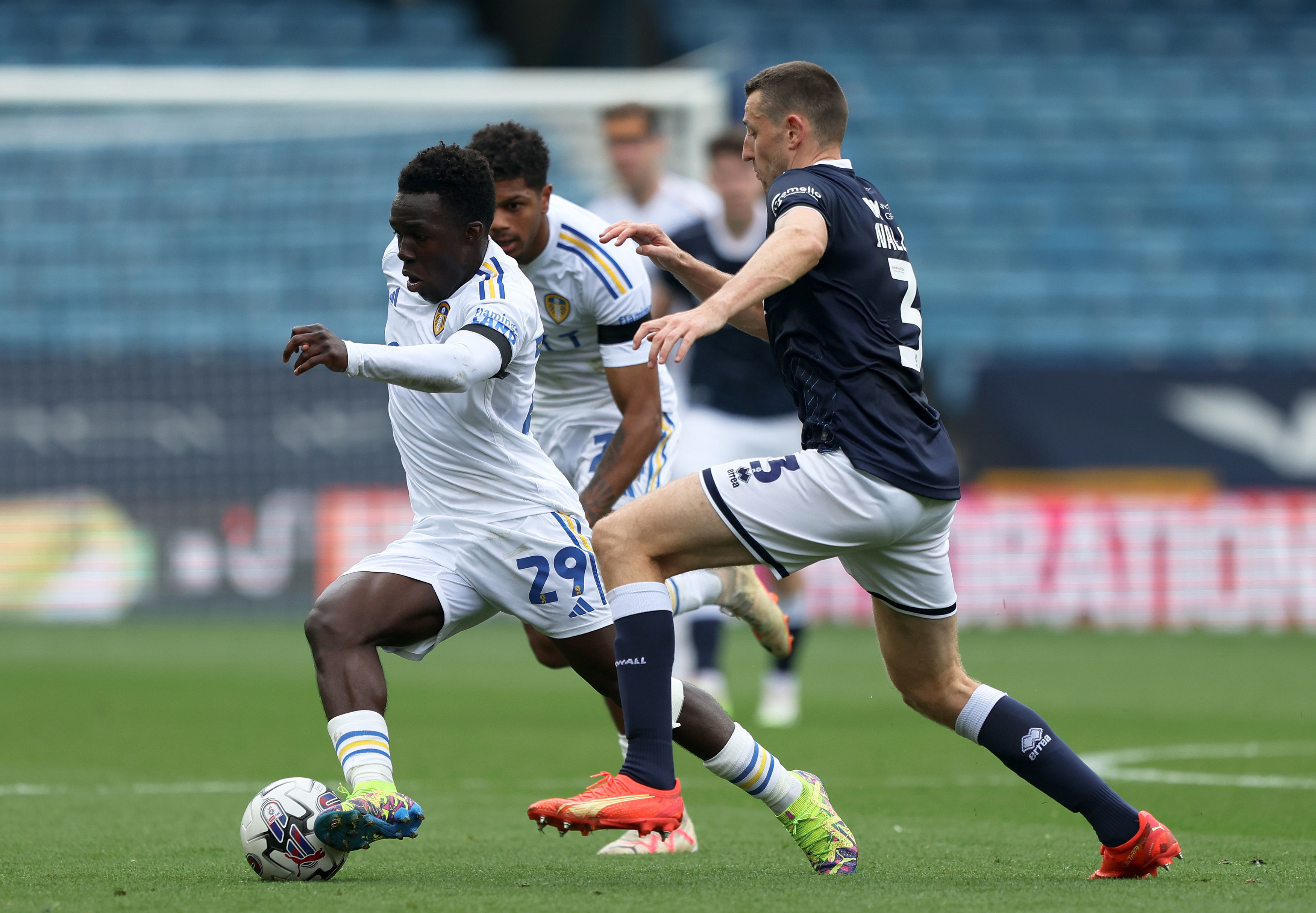 Joel Piroe of Leeds United and Billy Mitchell of Millwall during the  News Photo - Getty Images